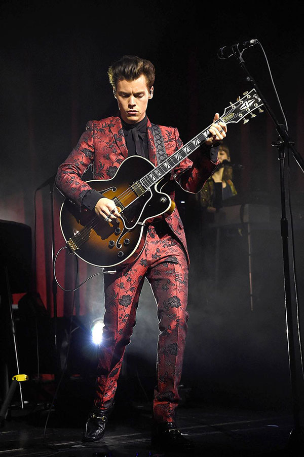 Harry Styles in custome red Gucci suit