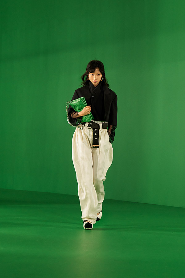 Louis Vuitton makes green screens fashionable in first physical show backed  by SG skyline