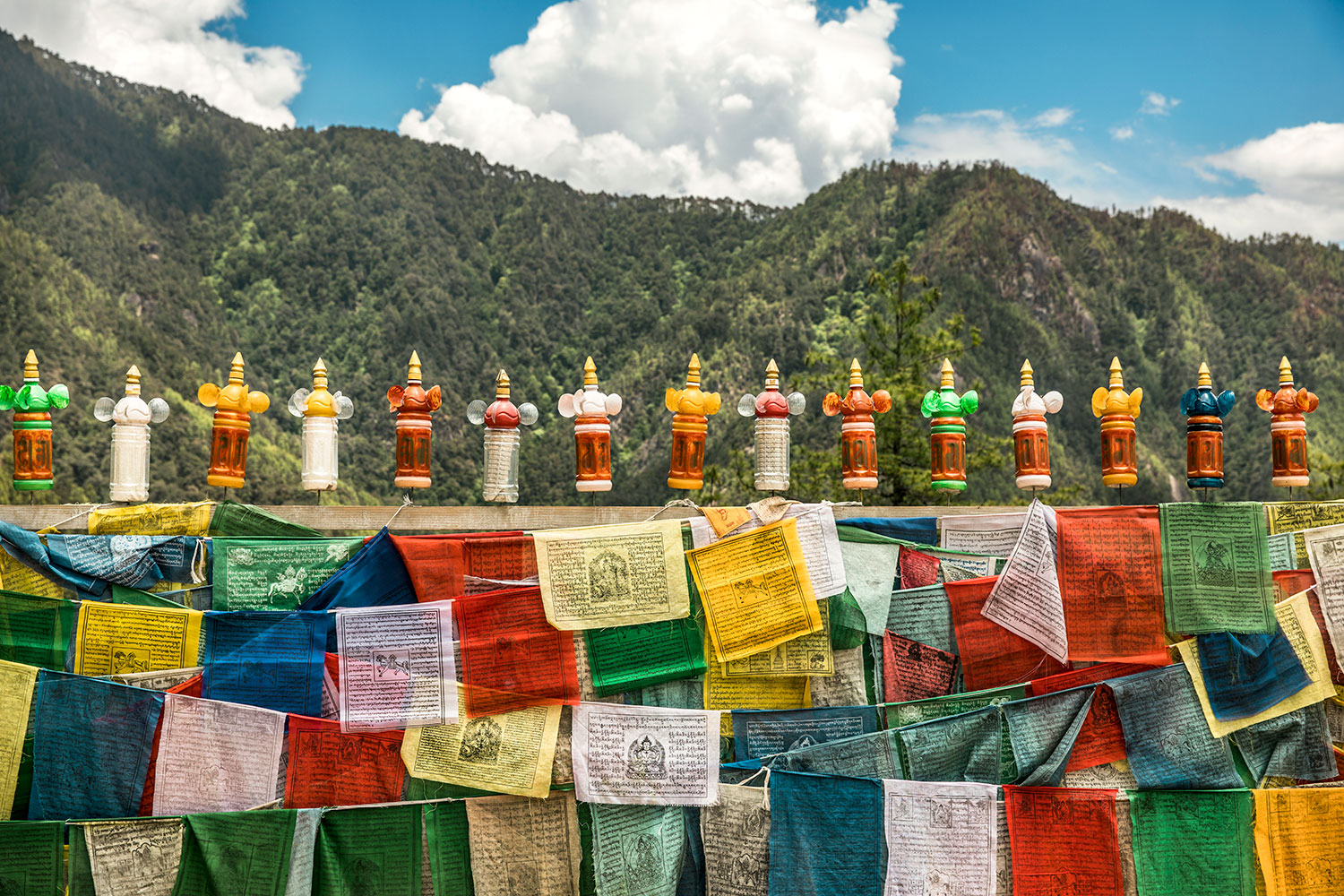 Prayer wheels and flags on display around Paro Valley.