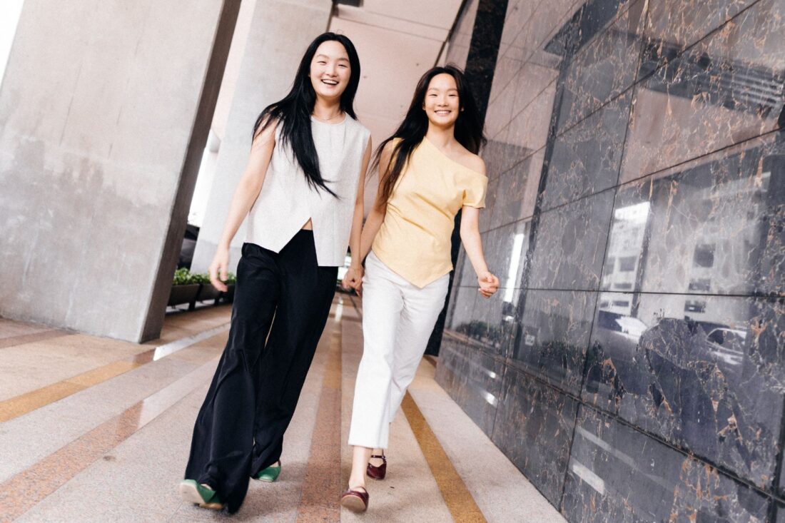 Twin sisters Riona and Renee Lau are rising models balancing school, fashion, and self-discovery as they navigate Malaysia’s creative scene.