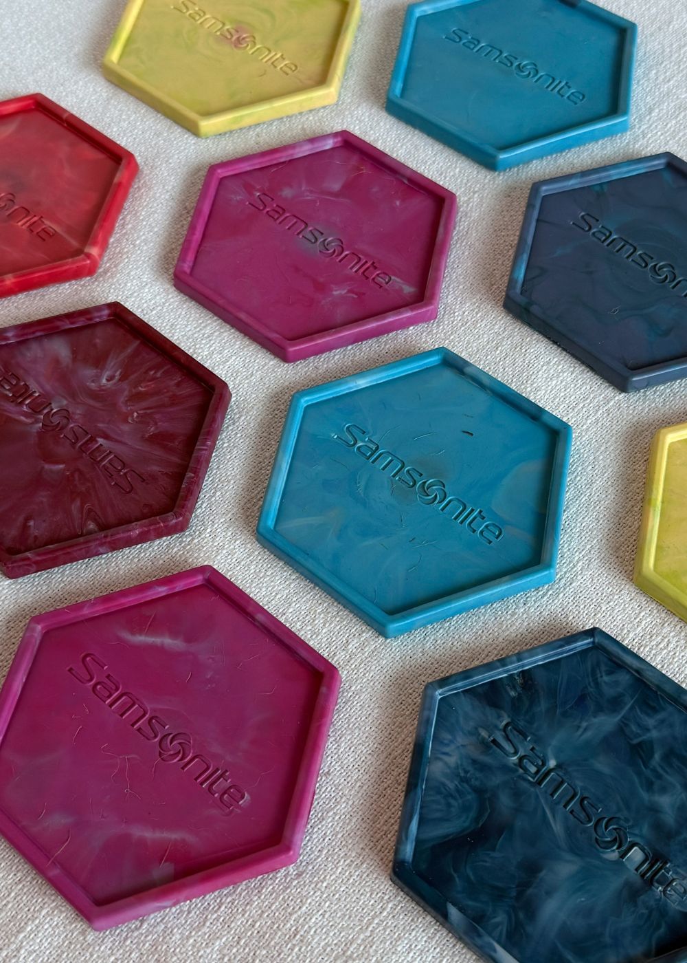 Coasters by Samsonite made from recycled old travel luggage.