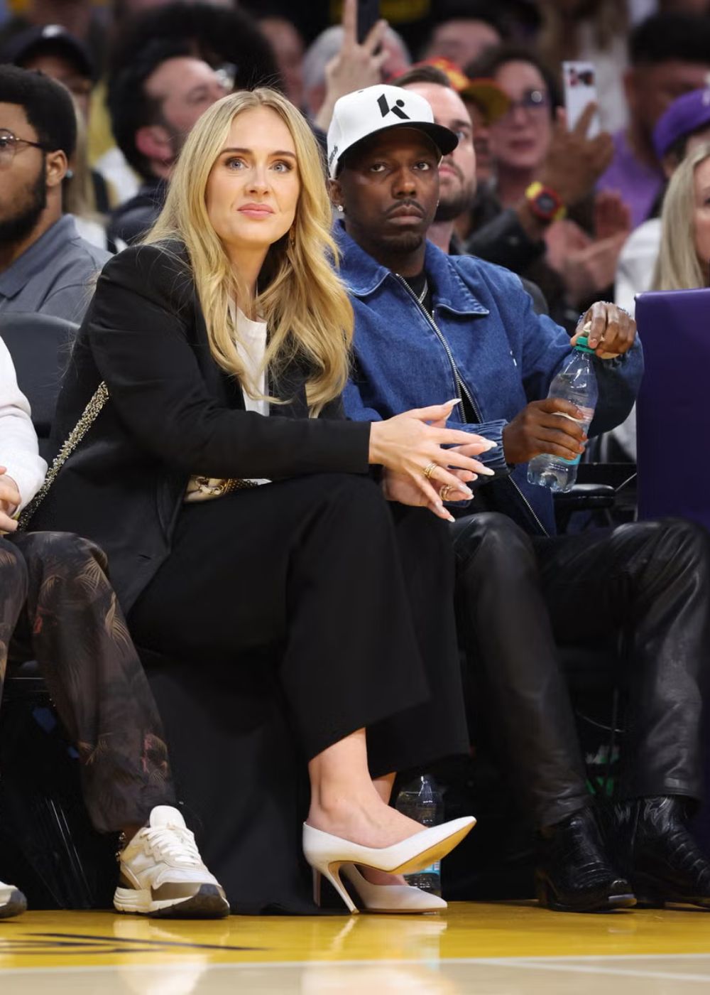 Adele and Rich Paul looking sharp during a basketball game. (Photo: Shutterstock)
