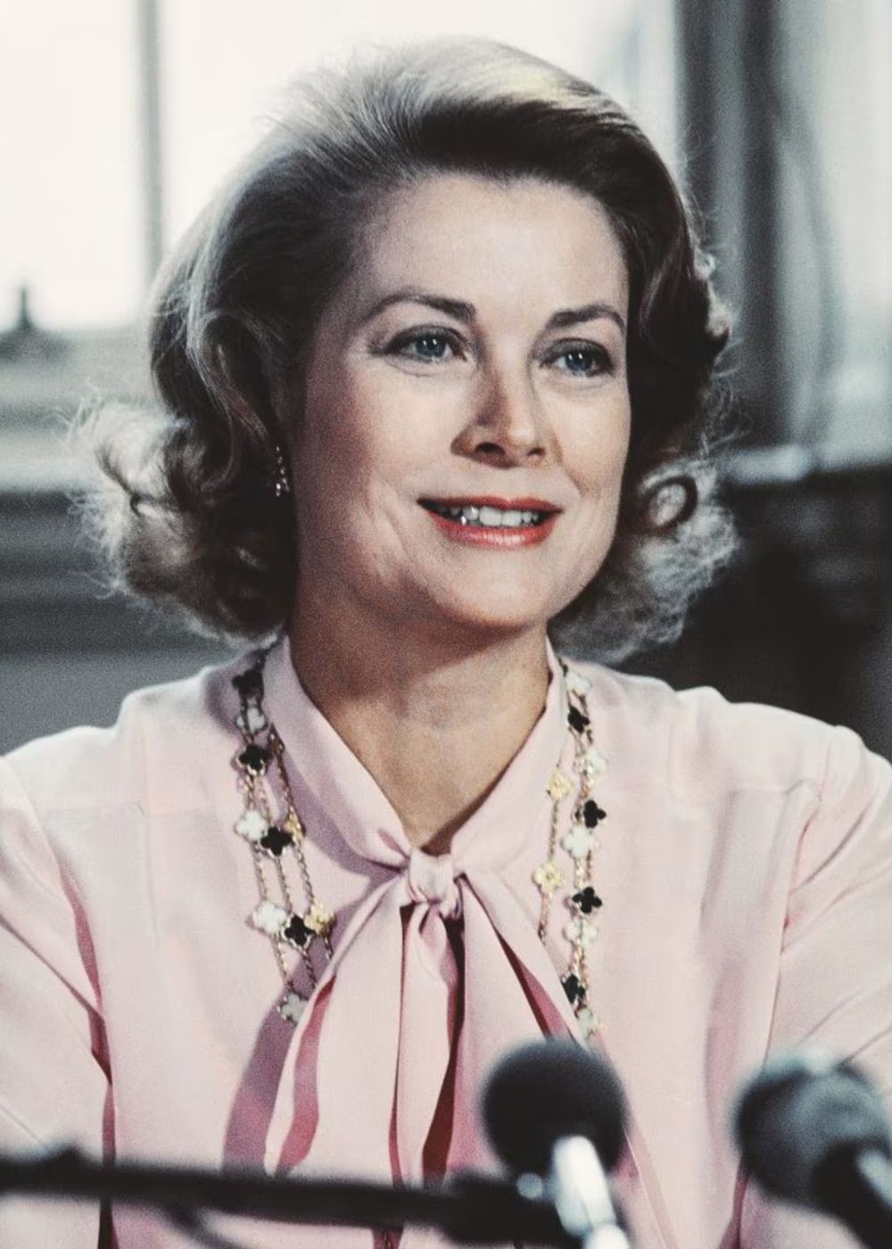 Grace Kelly gracing her neck with the long Alhambra necklace in black and white.
