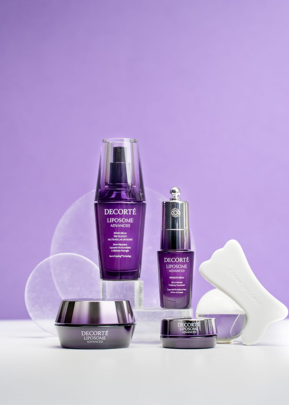 Left to right: DECORTÉ Liposome Advanced Repair Serum, Repair Eye Serum, Facial Cream, and Lip Serum.