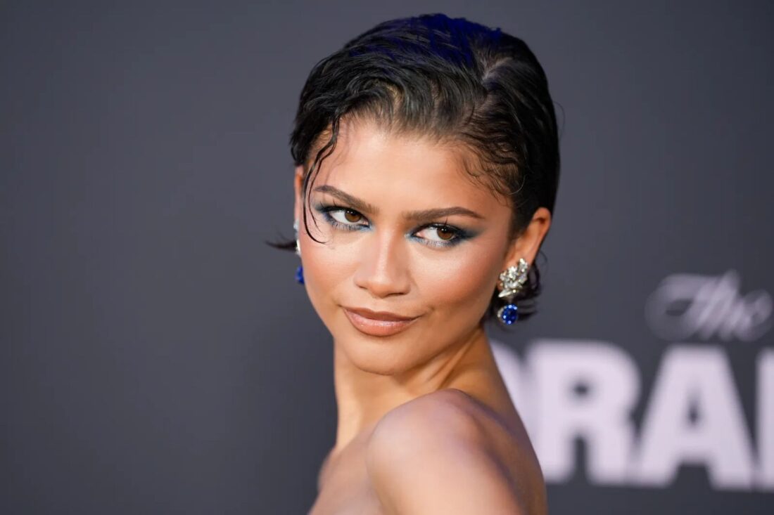 Blue eyeshadow returns from the ’80s with a bold, modern edge as maximalist makeup continues its rise beyond the clean girl aesthetic.